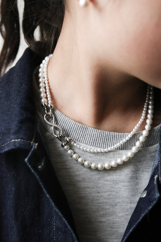 Thanks to its unique figure-8 clasp, both the fine and the bold pearl strands can be detached — giving you four elegant ways to wear it
